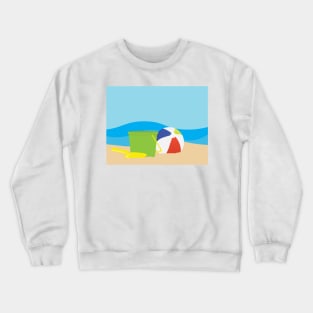 Green toy bucket, Yellow shavel and beach ball on Brown sand and Blue sea background Crewneck Sweatshirt